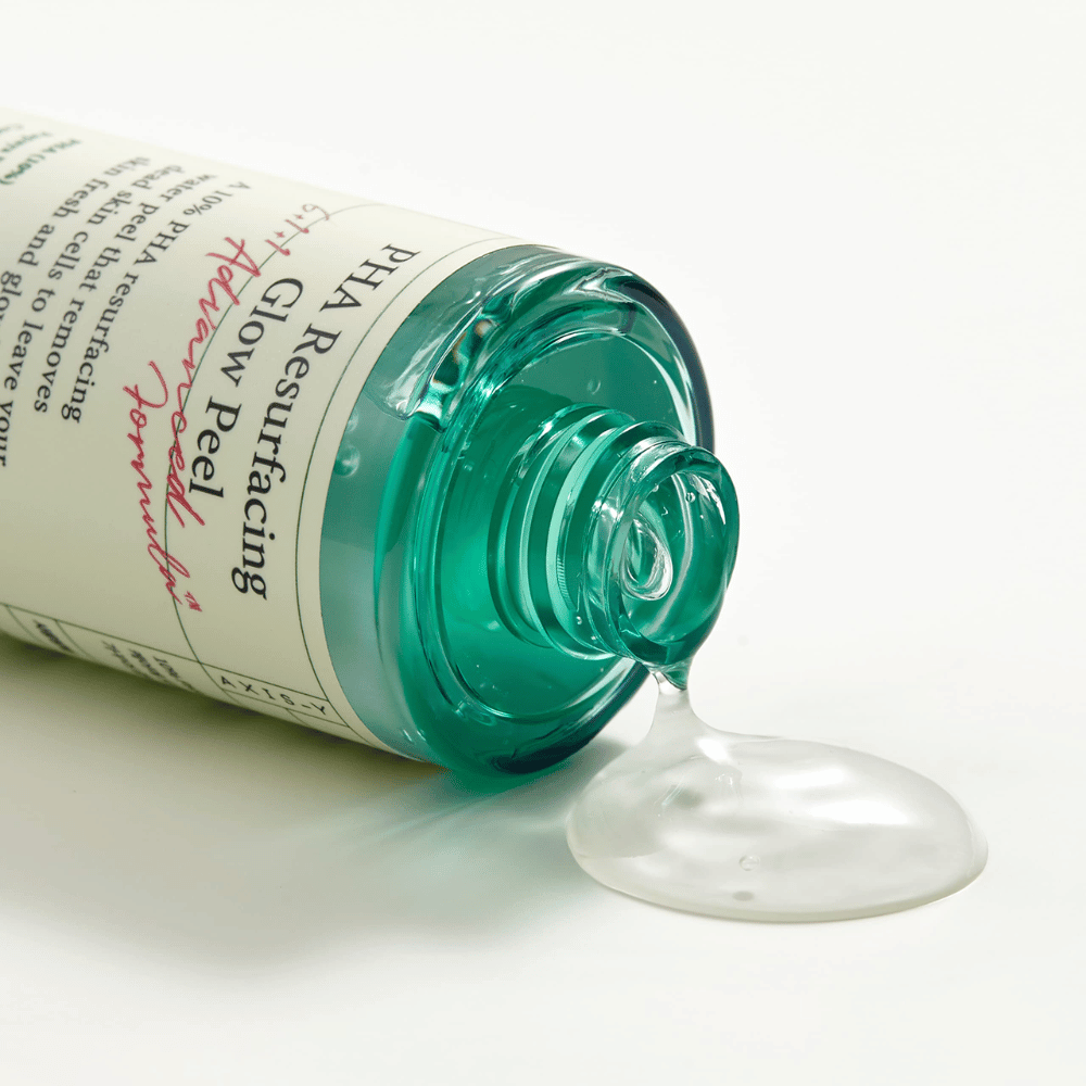 Uma garrafa AXIS - Y PHA Resurfacing Glow Peel 50ml sobre uma superfície lisa.