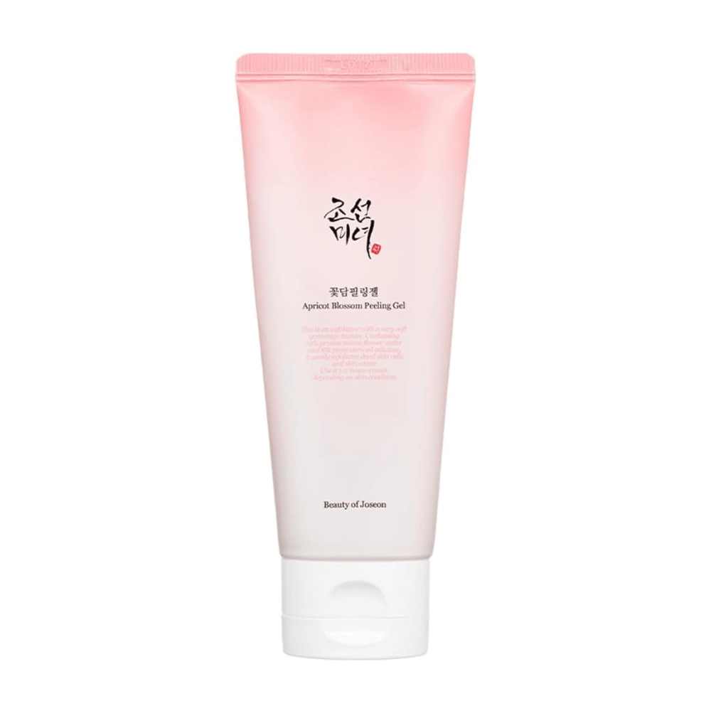 Um tubo rosa com Apricot Blossom Peeling Gel de Beauty of Joseon sobre um fundo branco.