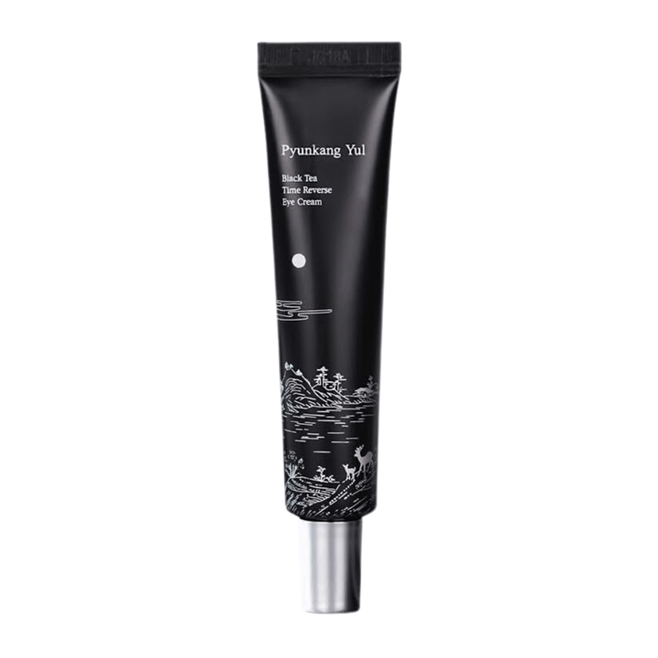 Pyunkang Yul Black Tea Time Reverse Eye Cream 25 ml em tubo preto com chá preto fermentado, peptídeos e ingredientes hidratantes para a zona dos olhos.
