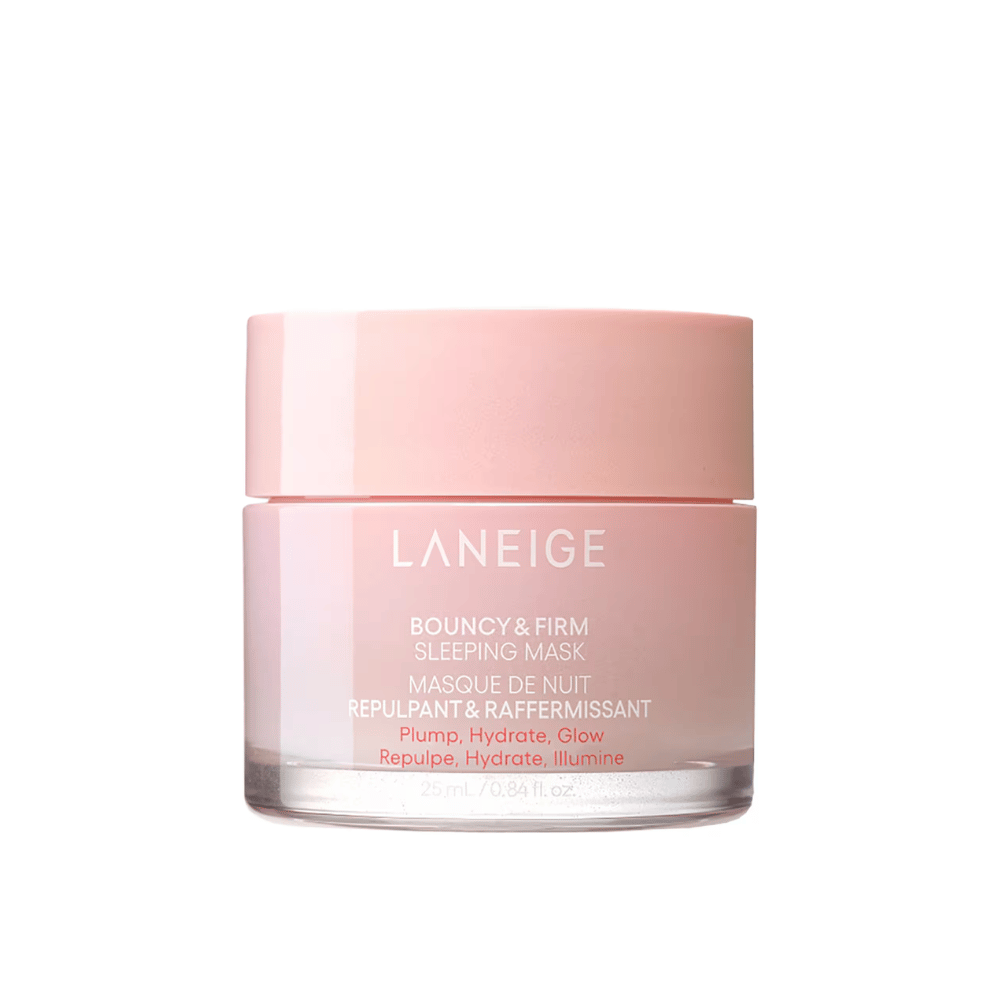 Laneige Bouncy & Firm Sleeping Mask em um frasco de vidro rosa com uma tampa correspondente. O produto, que contém 25 ml, é projetado para proporcionar volume, hidratação e brilho durante a noite. O texto no frasco inclui "Volume, Hidratar, Brilhar."