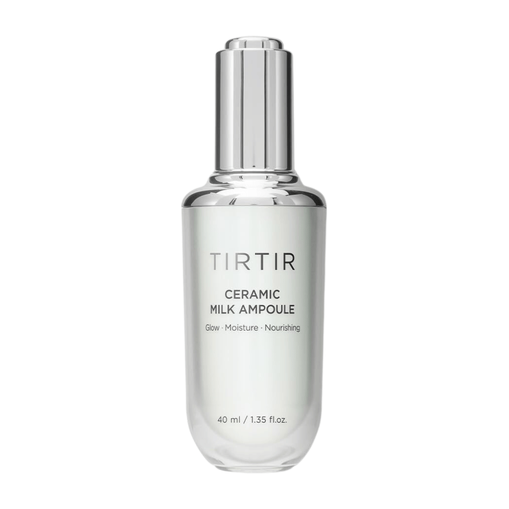  Uma garrafa transparente TIRTIR Ceramic Milk Ampoule, marcada com "Glow - Moisture - Nourishing", em um fundo branco.