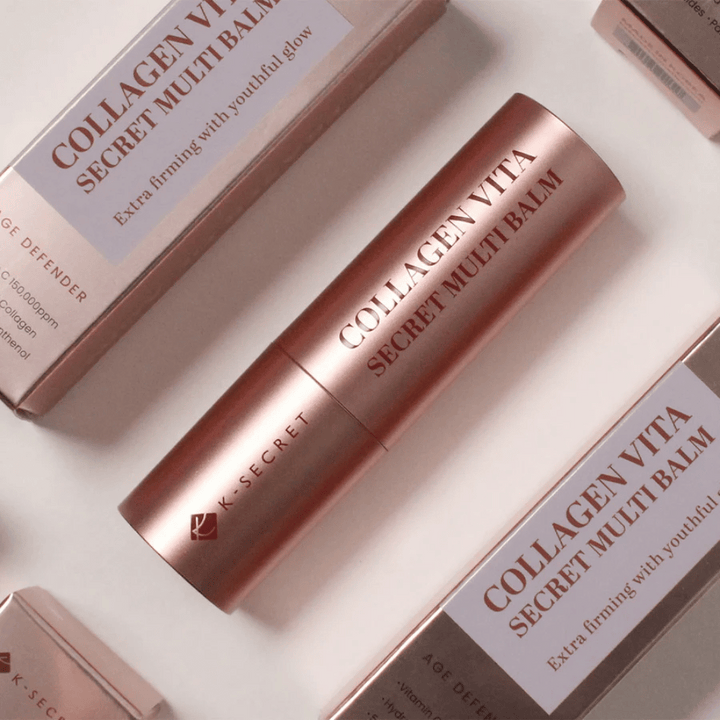 K-Secret Collagen Vita Secret Multi Balm med förpackningar i bakgrunden, text ”Extra firming with youthful glow”.