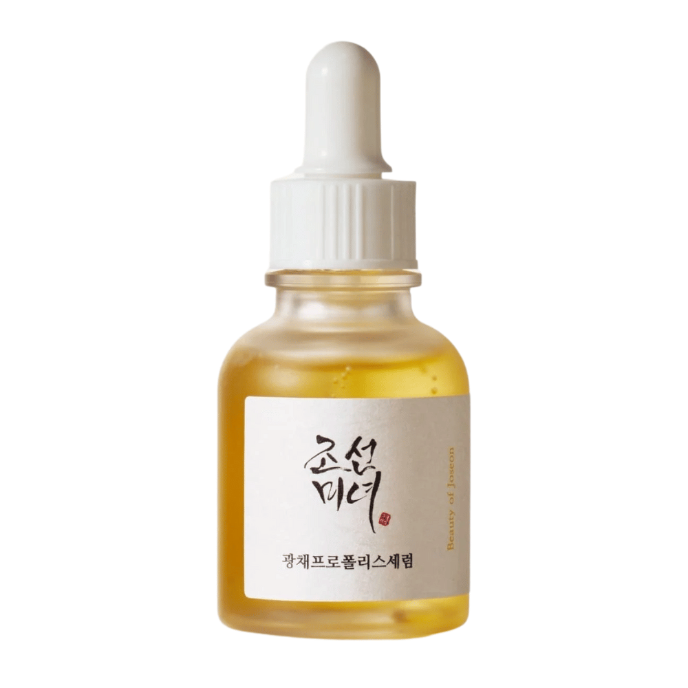 Frasco de Beauty of Joseon Glow Serum com pipeta branca e soro dourado, um produto iluminador com própolis e niacinamida.