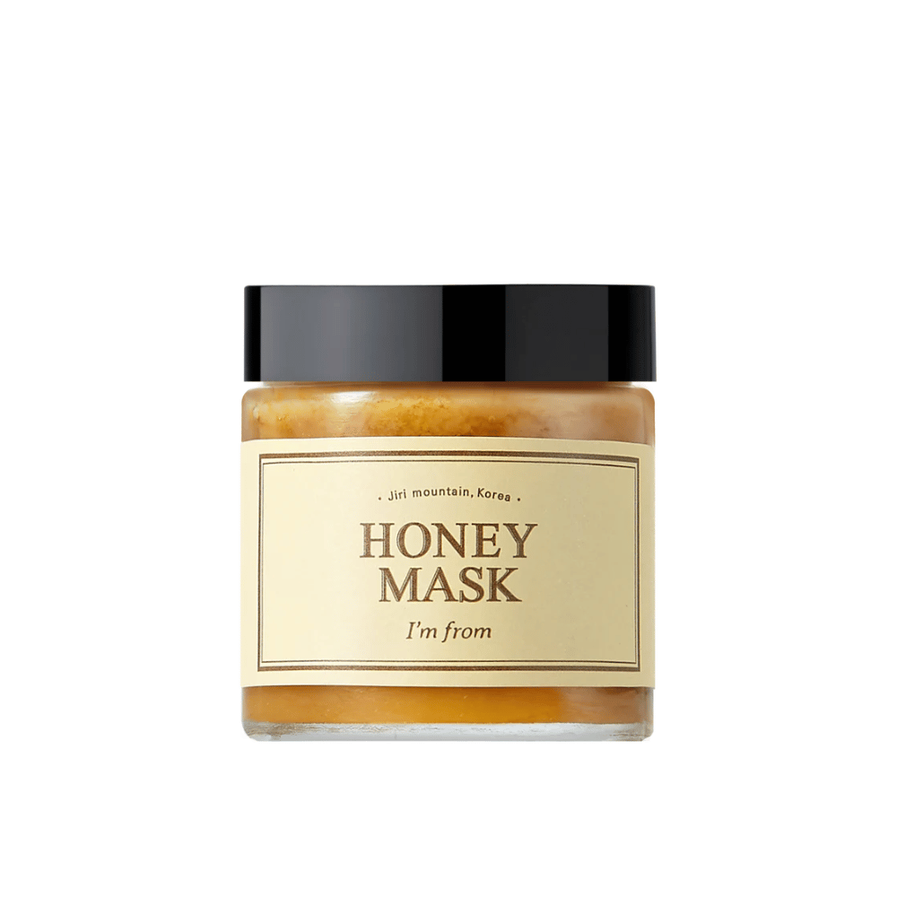  Um frasco "I'm from Honey Mask", com conteúdo natural de mel, contra um fundo branco.