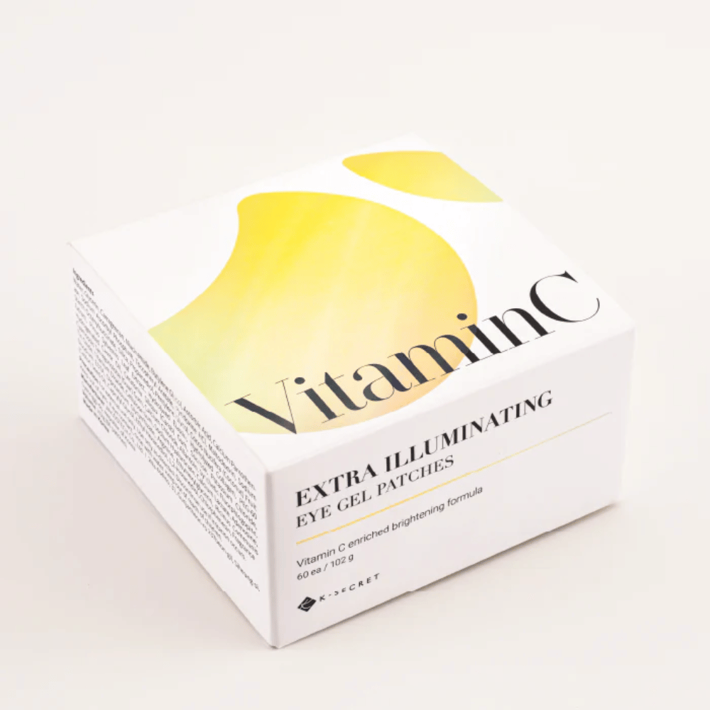 Embalagem de K-Secret Extra Illuminating Eye Gel Patches com vitamina C em design branco e amarelo.