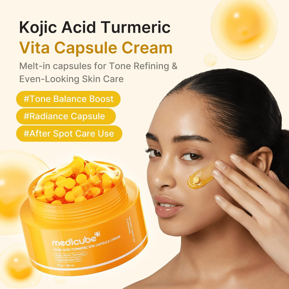 4. Medicube Kojic Acid Turmeric Vita Capsule Cream – creme facial iluminador com cápsulas aplicado na bochecha