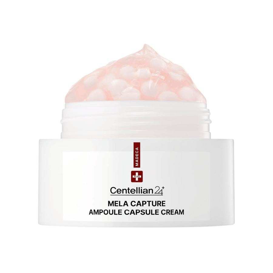 Close-up de Centellian24 Madeca Mela Capture Ampoule Capsule Cream que mostra o creme em gel rosa com cápsulas de ampola encapsuladas no frasco.