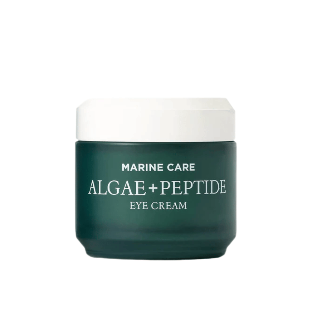 Heimish Marine Care Algae + Peptide Eye Cream em um pote verde escuro com tampa branca. Um creme para os olhos enriquecido com algas e peptídeos para hidratar, iluminar e reduzir linhas finas ao redor dos olhos.