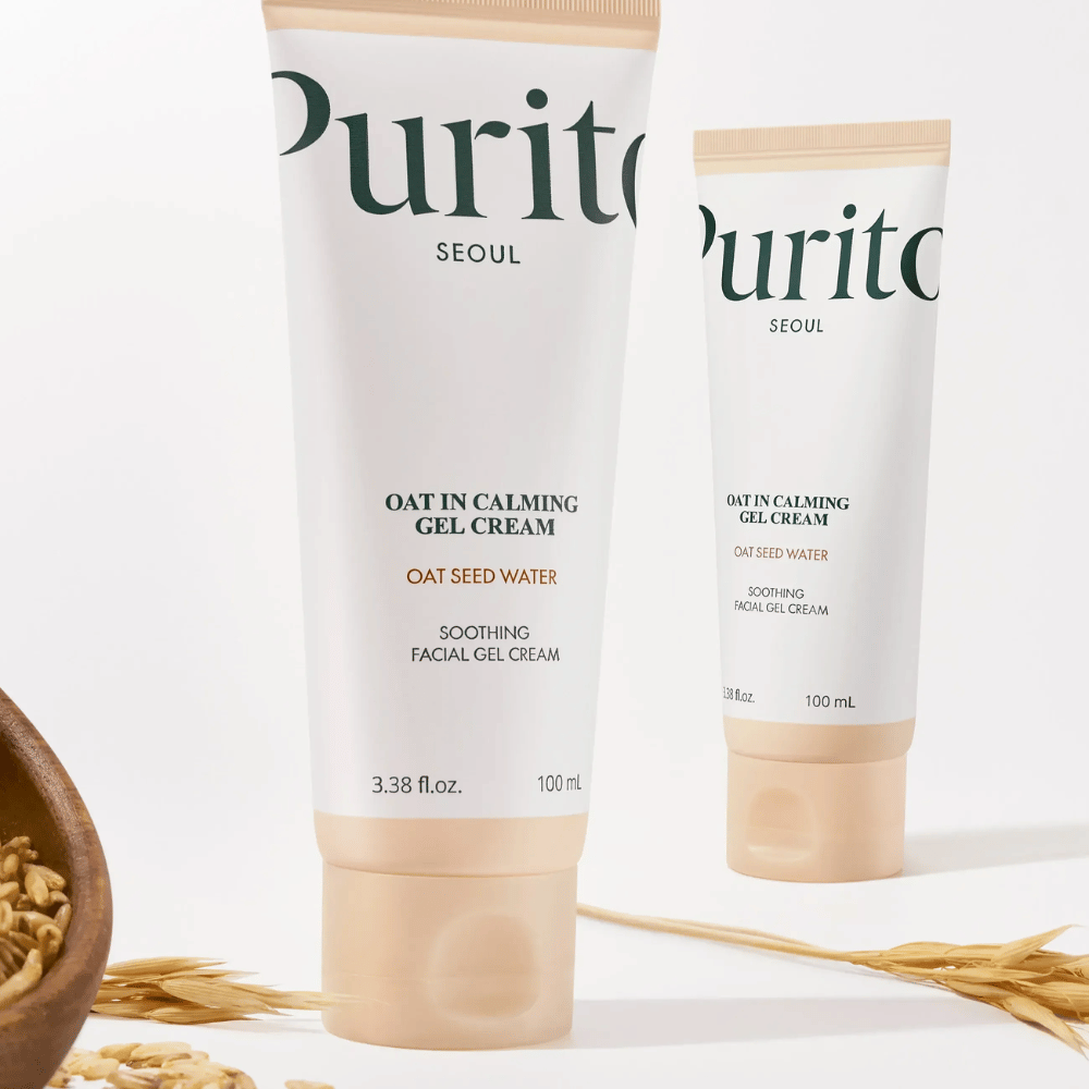 Purito Oat-In Calming Gel Cream em tubo bege, colocado com grãos de aveia. Acalma a pele sensível com água de aveia e textura em gel leve.