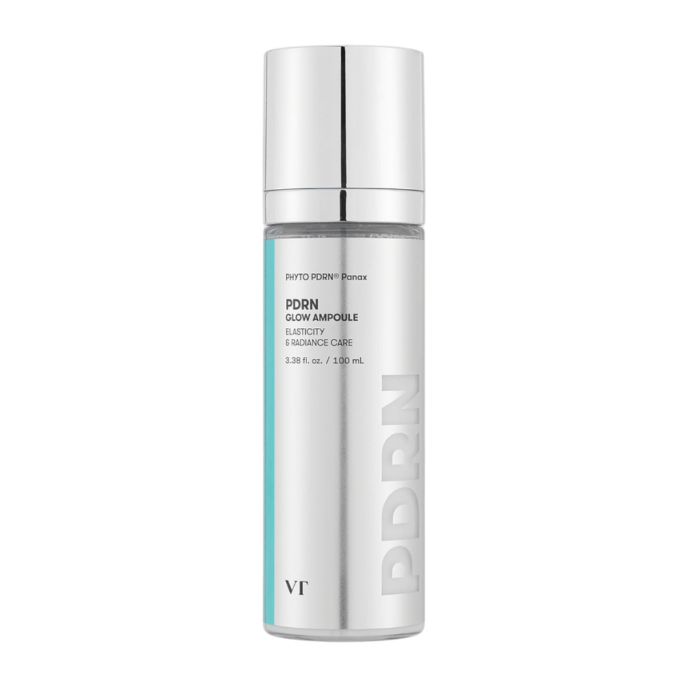 VT PDRN Glow Ampoule em um frasco prateado com bomba, marcação que indica conteúdo de 100 ml. O produto é projetado para elasticidade e pele radiante, com o texto "PHYTO PDRN® Panax" e "Elasticity & Radiance Care".