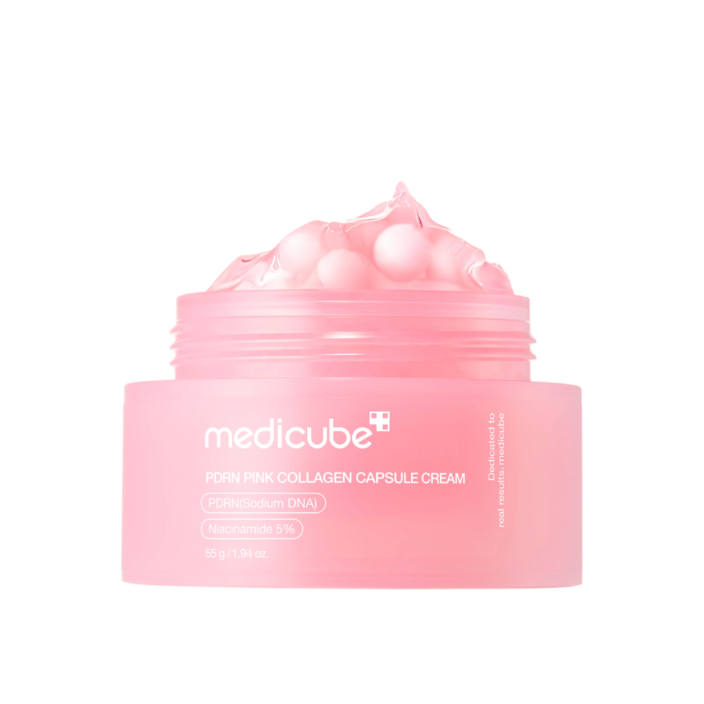 Imagem do produto de Medicube PDRN Pink Collagen Capsule Cream com cápsulas rosa visíveis em um frasco rosa transparente, projetado para hidratar e uniformizar o tom da pele.