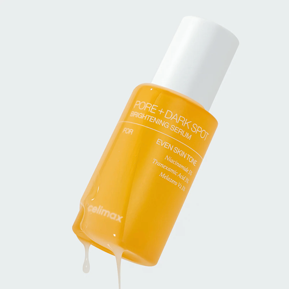 Celimax Pore + Dark Spot Brightening Serum em garrafa amarela com tampa branca, gotas de soro escorrem pela garrafa.