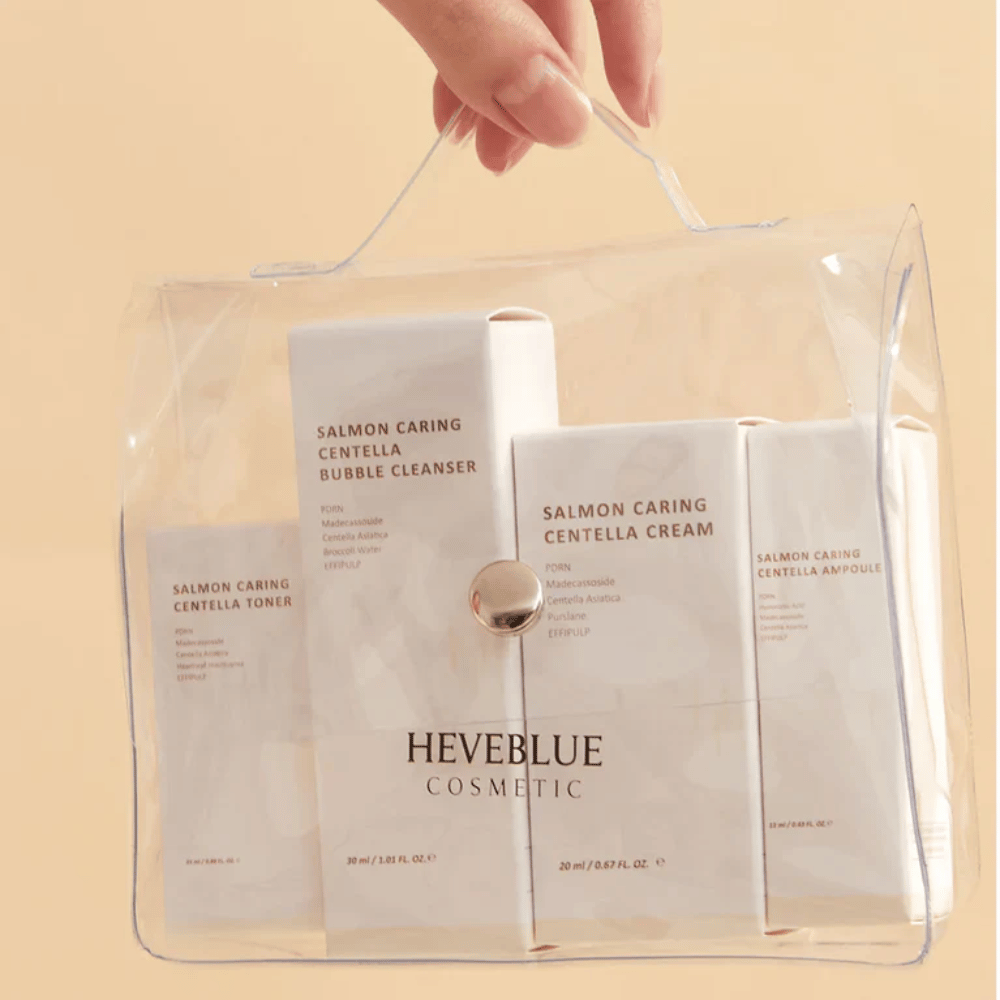 Heveblue Salmon Caring Centella Special Travel Kit nécessaire – conjunto completo de cuidados com a pele coreano com toner, cleanser, creme e ampola em bolsa de viagem transparente.