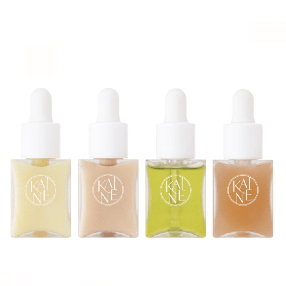 Quatro frascos de soro coloridos da KAINÉ Serum Discovery Kit com tampa de pipeta, projetados para atender diferentes necessidades da pele em uma embalagem minimalista e elegante.