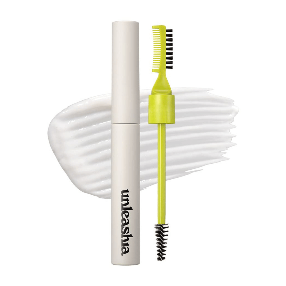 Pomada para sobrancelhas "unleashia" com aplicador, pente verde e escova preta contra um fundo branco ondulado.