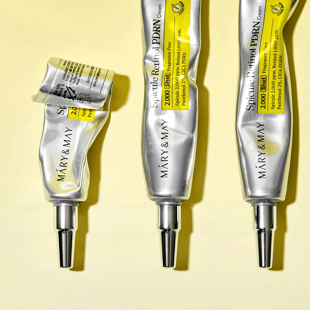 MARY & MAY Spicule Retinol PDRN Cream com uso visível em tubo, mostrando a consistência do creme e aplicador direcionado para aplicação precisa na pele.