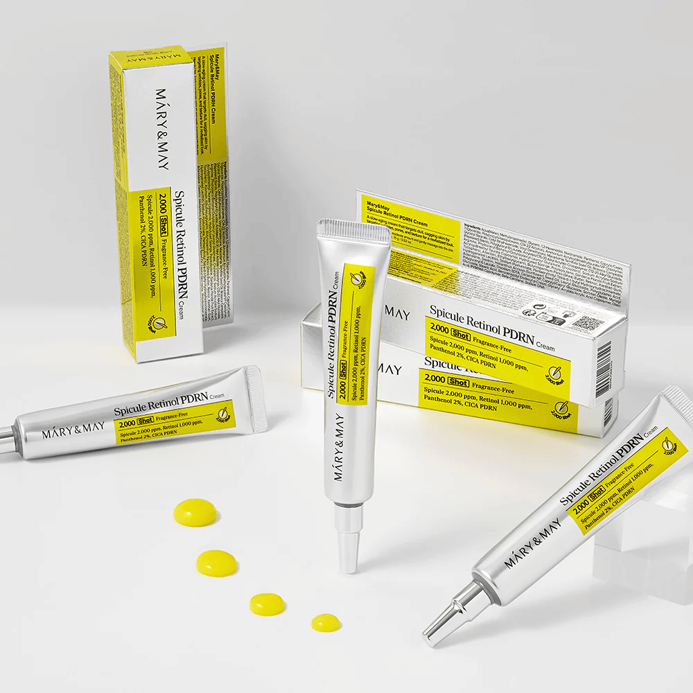 MARY & MAY Spicule Retinol PDRN Cream com vários tubos e textura de creme visível, desenvolvido para estimular a renovação celular, melhorar a elasticidade e proporcionar um tom de pele mais uniforme.