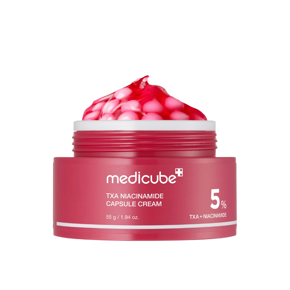 Medicube TXA Niacinamide Capsule Cream em pote com cápsulas rosa em forma de gel, mostrando marca de produto clara com 5% TXA + Niacinamida.