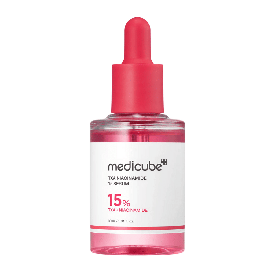 Medicube TXA Niacinamide 15 Serum i genomskinlig flaska med rosa pipett – innehåller 15 % tranexaminsyra och niacinamid för en jämnare hudton och klarare lyster.