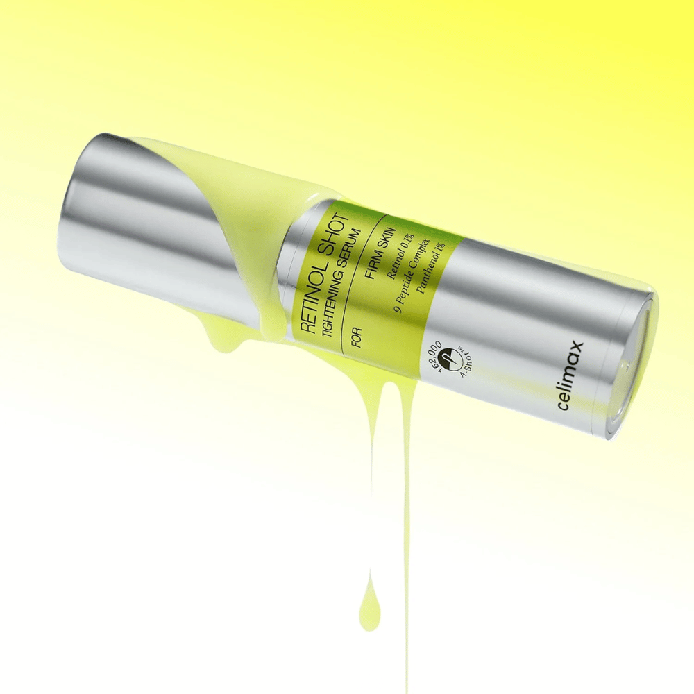 Imagem do produto The Vita-A Retinol Shot Tightening Serum de Celimax com soro amarelo escorrendo pela garrafa contra um fundo amarelo claro.