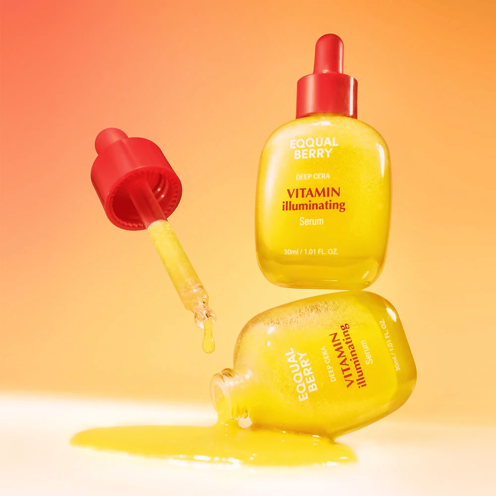 Equal Berry Vitamin Illuminating Serum em uma garrafa amarela brilhante com pipeta vermelha. Textura líquida e fundo energético criam uma sensação vibrante e fresca.