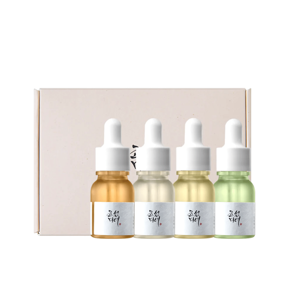 Uma caixa com três frascos Hanbang Serum Discovery Kit 4 unid de Beauty of Joseon, cada um promovendo um brilho juvenil e reduzindo rugas.